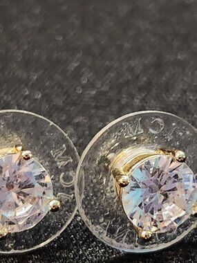 Signed JCM China cz stud earrings in gold tone